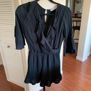 Abercrombie and Fitch, very cute black ruffled romper, with cutout designs
